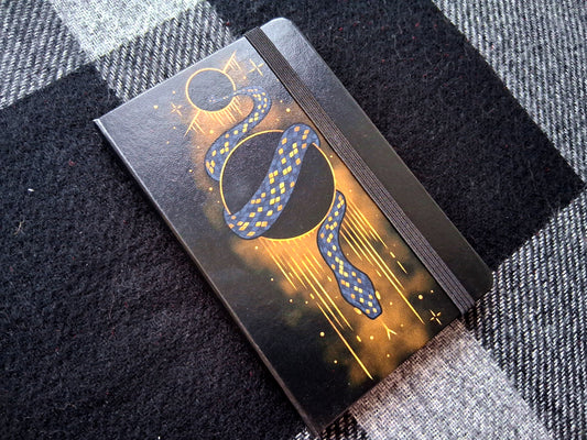 A6 Leatherette Dotted Notebook with Cosmic Snake Design